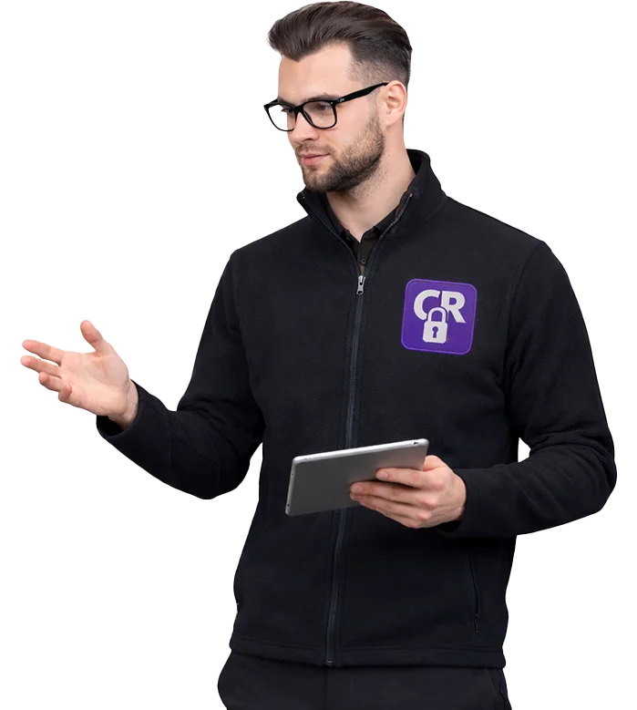 Man presenting with tablet and logo jacket